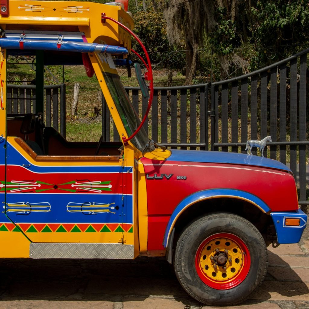 Vibrant traditional chiva bus parked outdoors in Barbosa, Colombia, viajes personalizados