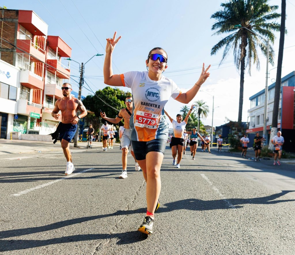 Energetic runners participating in a city marathon, showcasing enthusiasm and sportsmanship, turismo en Medellín