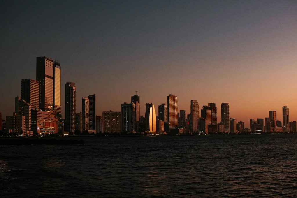 Stunning skyline view of Cartagena's modern buildings at dusk, reflecting vibrant urban life, Qué hacer en Cartagena