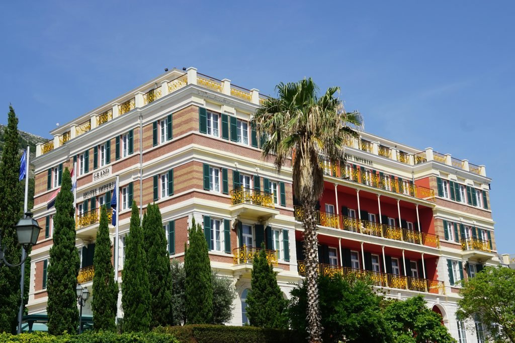 Stunning exterior view of the Hilton Imperial Hotel with vibrant balconies in Dubrovnik., hotelería