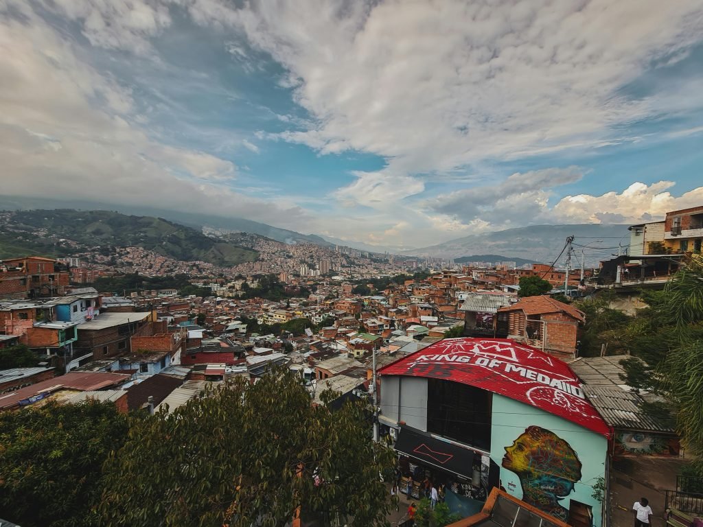 Explore the vibrant and sprawling cityscape of Medellín, showcasing its unique blend of architecture and culture., ¿es seguro viajar a Colombia?