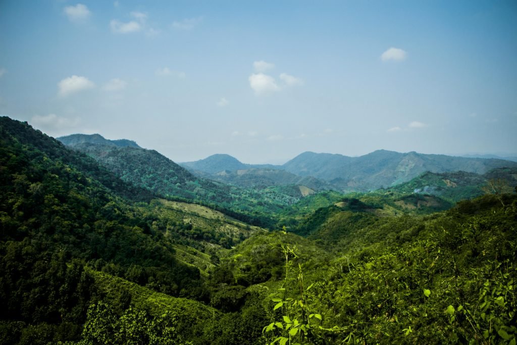 Explore the lush, rolling hills of Colombia's Andes, captured in this breathtaking mountain landscape photo., ¿es seguro viajar a Colombia?