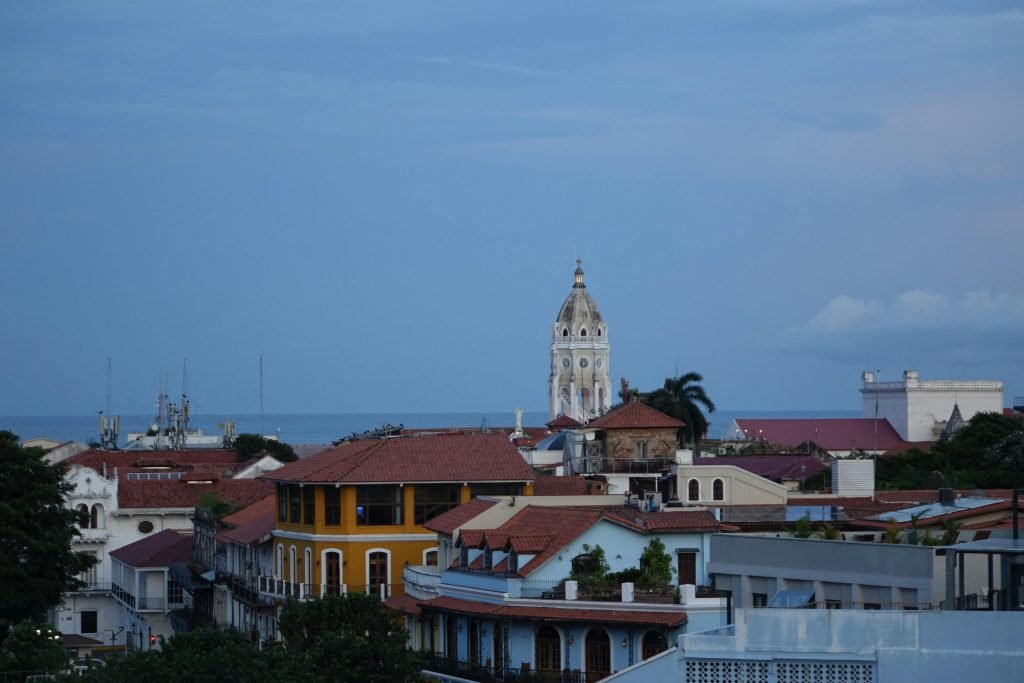 Rooftop view of Cartagena's colorful architecture with the sea in the background., paquetes a Cartagena todo incluido