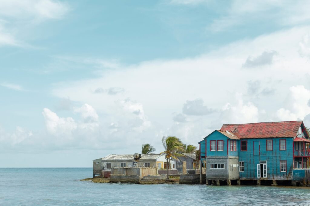 Charming coastal houses by the sea in San Andrés, Colombia, with blue skies. Providencia