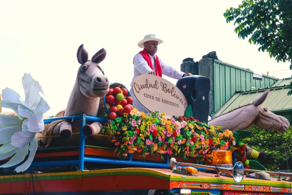 Colorful parade float with floral decorations in Medellín's Feria de Flores.